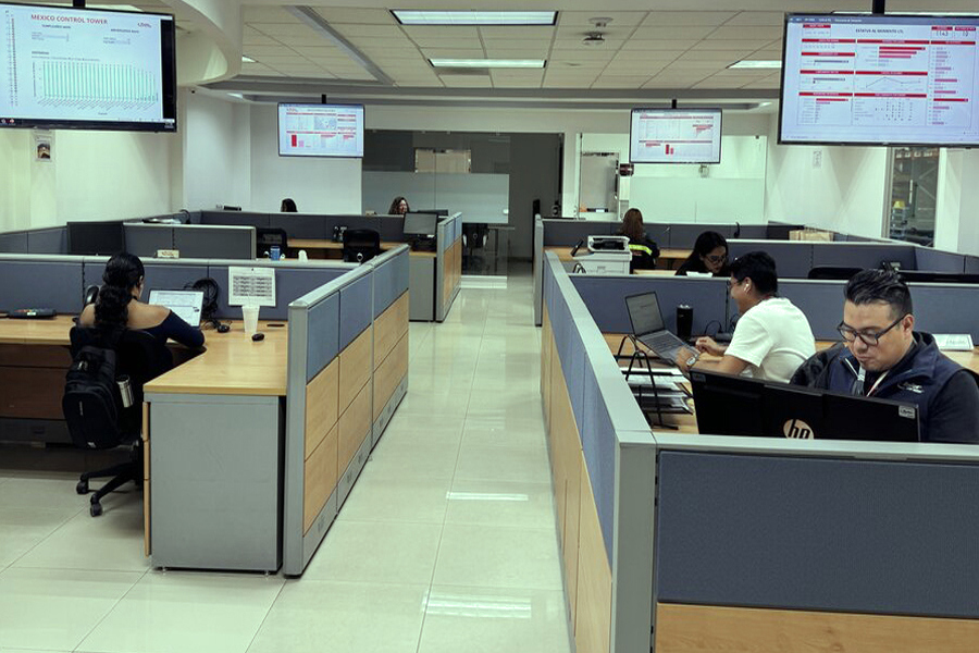 employees at their desks in front of pc's